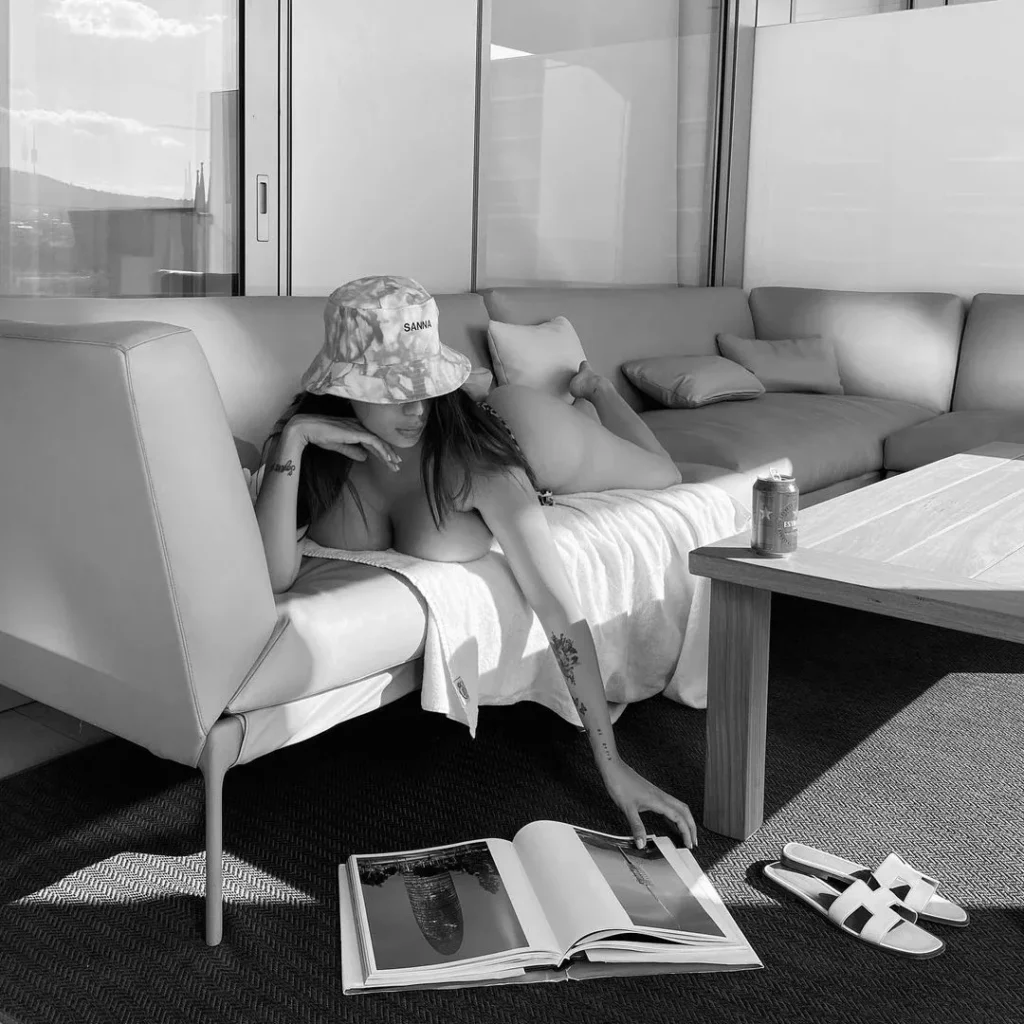 Sanna Meira lying on Sofa